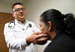 Dr. Jose Javier Hernandez examines a patient