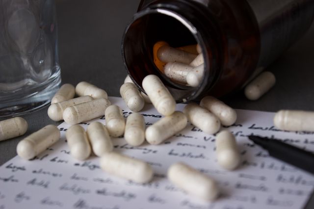 Pills, pill bottle and note 