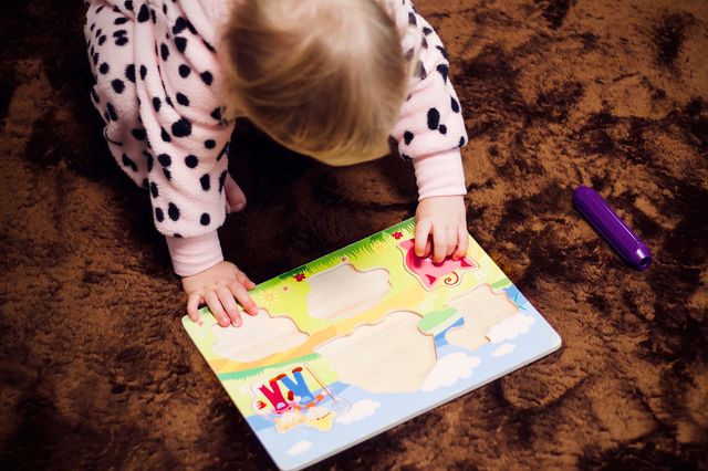 Child playing with puzzle