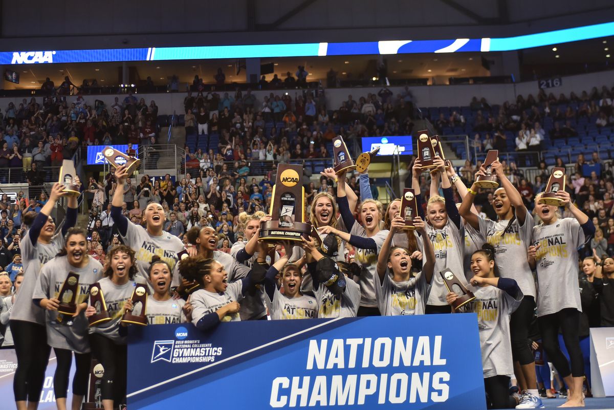 UCLA gymnastics with NCAA trophy