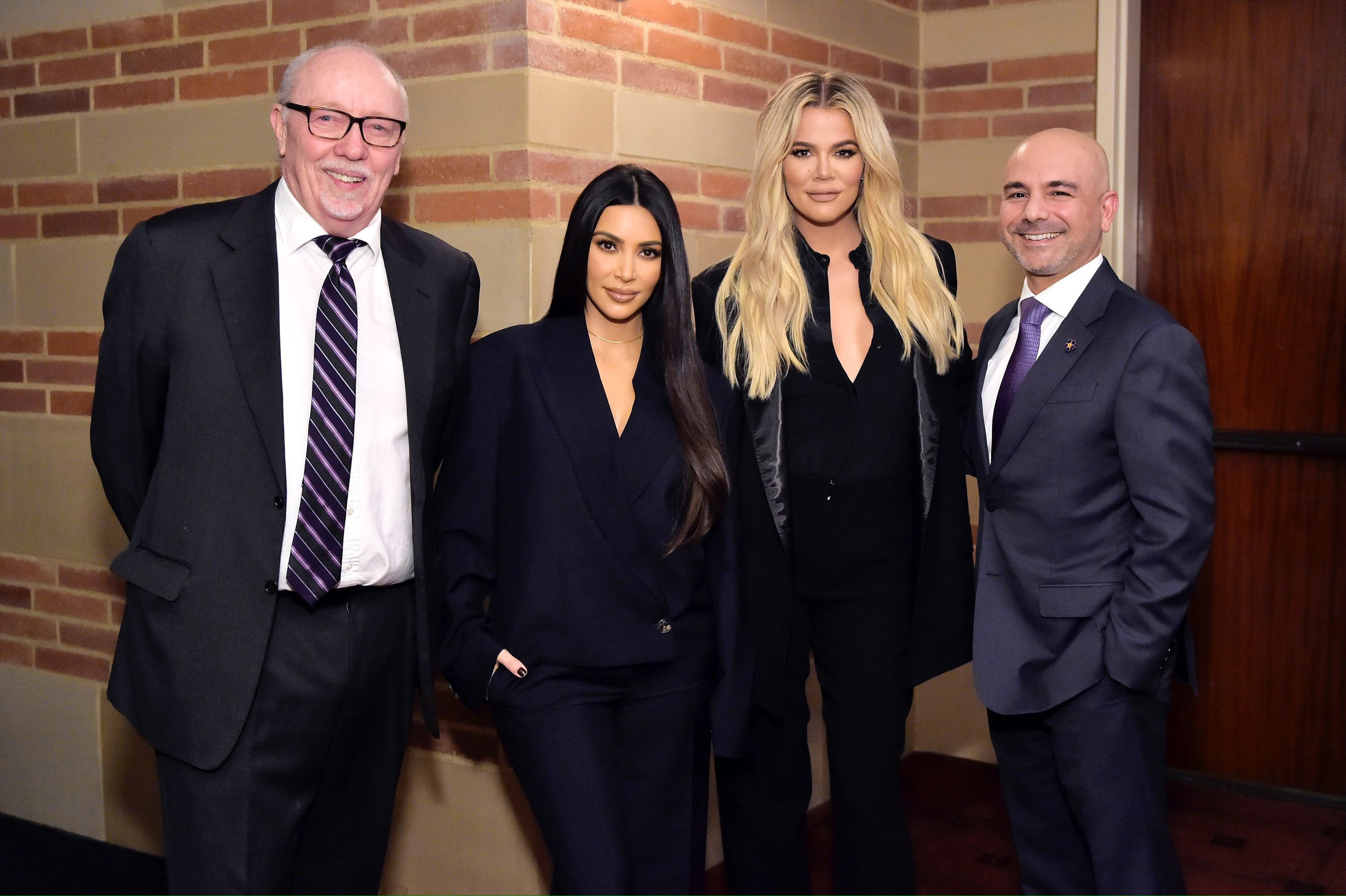 From left, Terry George (director of “The Promise”), Kim Kardashian, Khloe Kardashian and Dr. Eric Esrailian stand together in front of Royce Hall in 2019