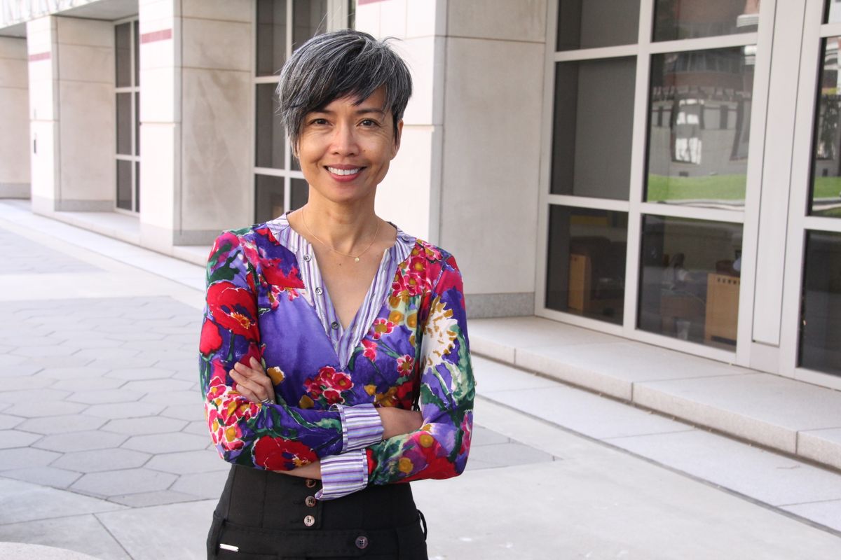 Ninez Ponce standing outside with arms crossed