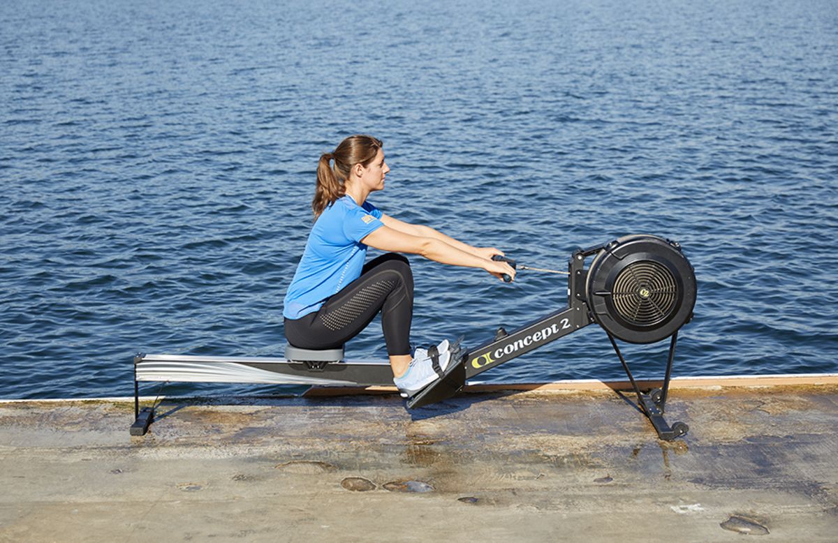 4. That’s when — keeping your arms straight and body angled forward — you bend your knees and start to slide the seat toward the catch. Quick Take Rowing 4