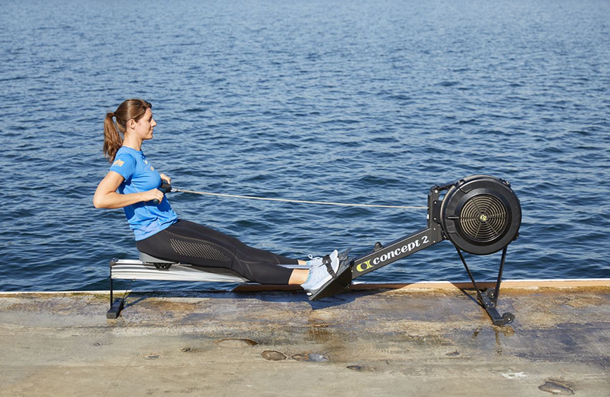 6. Keep your arms straight until your legs are straight, lean back with a slight push off the footboard, then pull your arms in. This is the finish, where you began. Quick Take Rowing 6