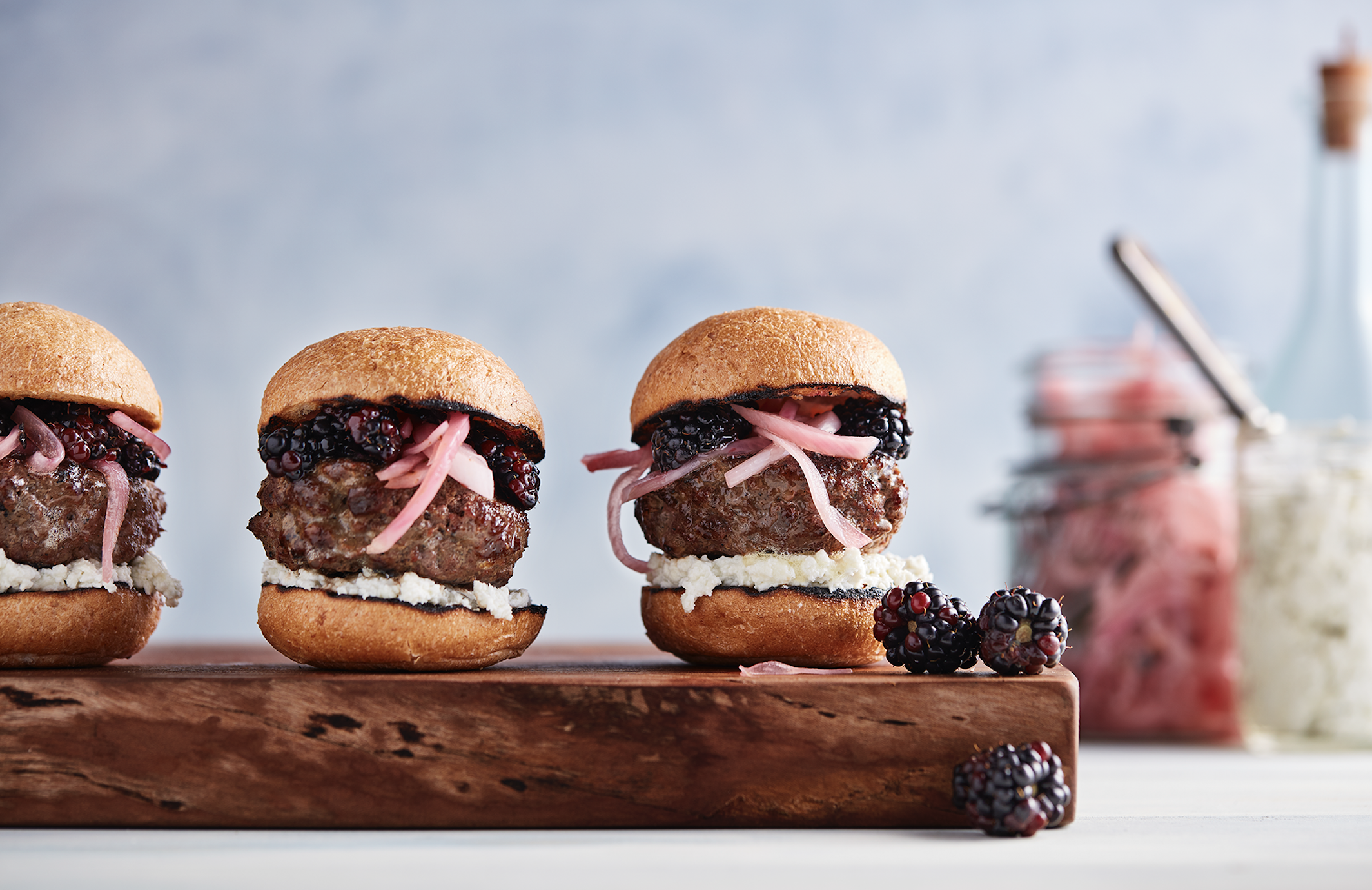 Bison burgers with blackberries, blue cheese and pickled onions