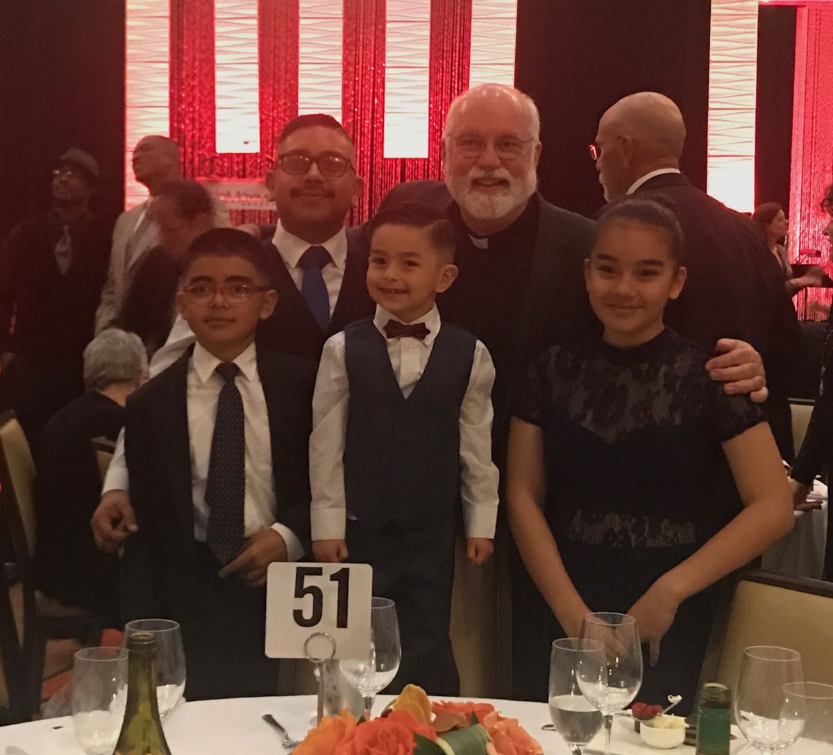 Romen Lopez with kids and Father Greg Boyle