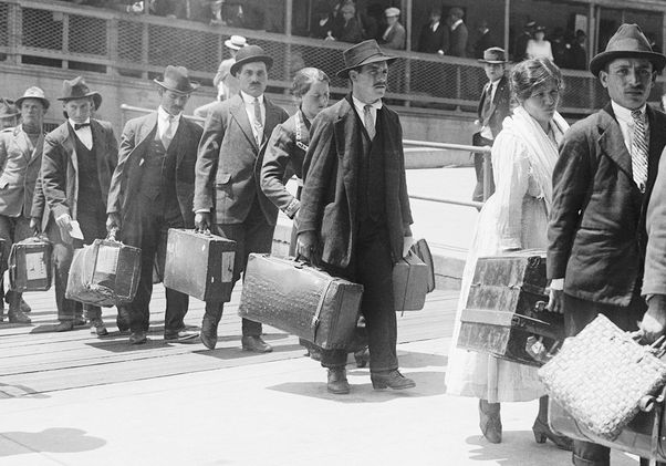 Immigrants lined up getting off a boat