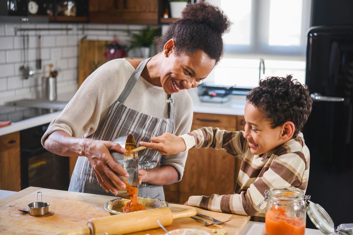 Mother and son baking together