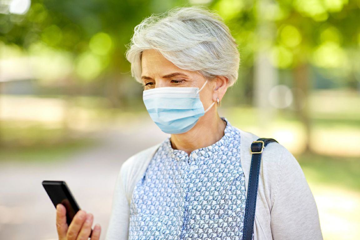Older woman looking at cell phone