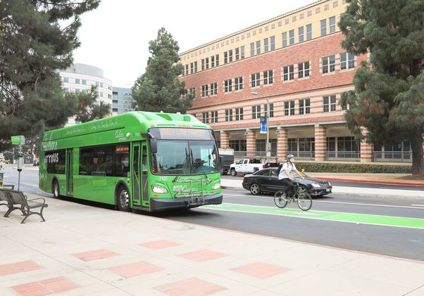 Bus, bike and car traffic on Westwood Plaza