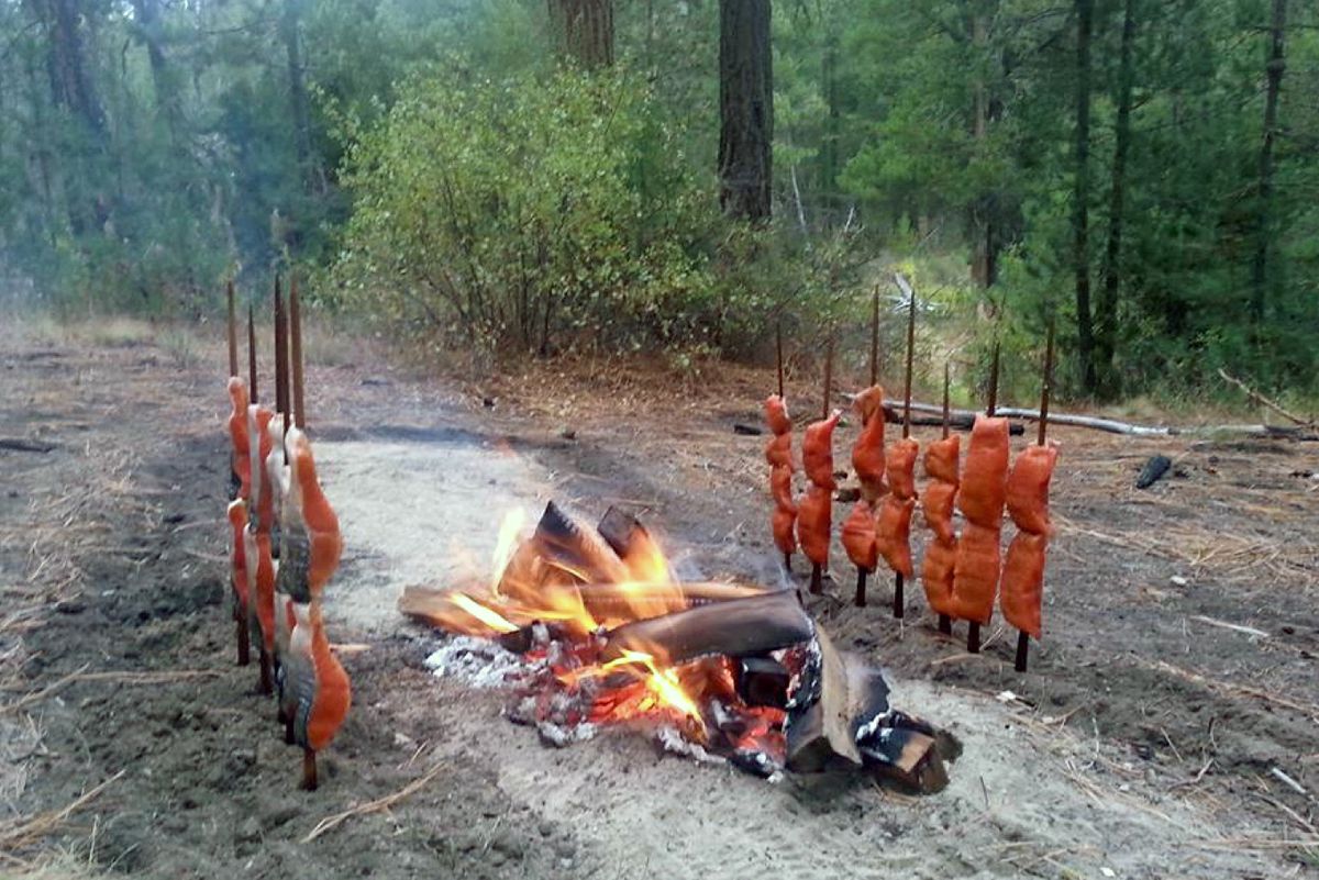 Salmon cooking open fire