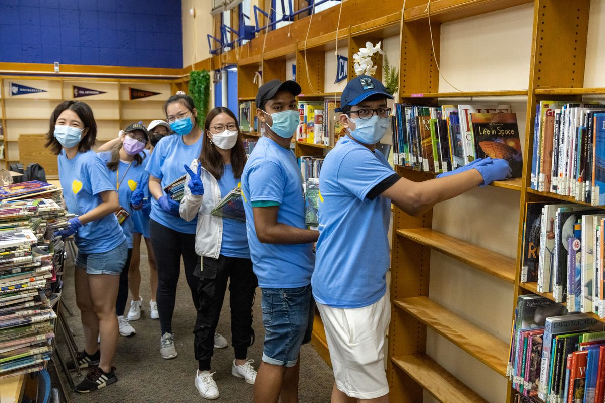 UCLA Volunteer Day 2021 - Students re-shelving books