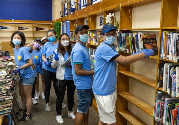 UCLA Volunteer Day 2021 - Students re-shelving books