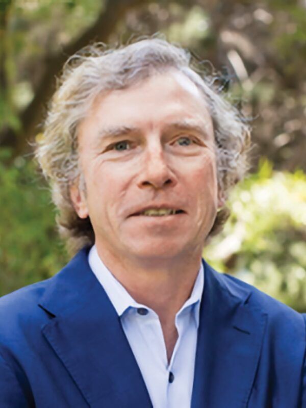 Headshot of Michael Jerrett, wearing a blue blazer, photographed outdoors.