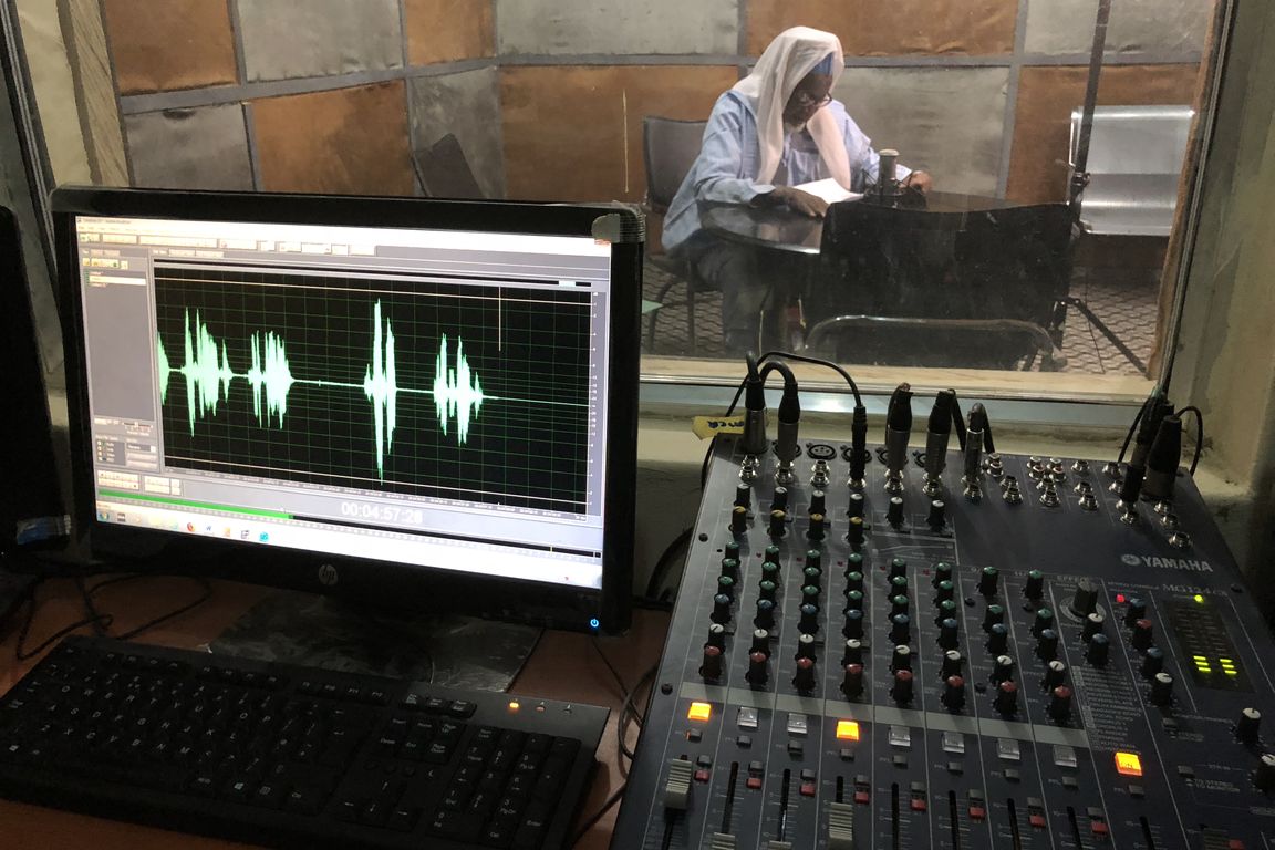 Sheik recording a message in the studio