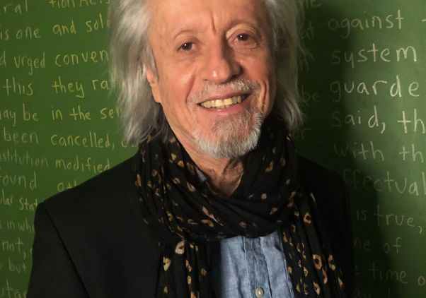 Paul Abramson in front of chalkboard