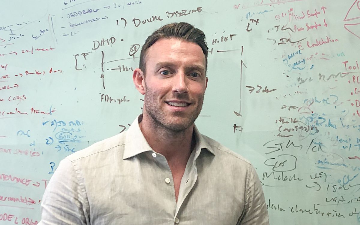 David Nathanson in front of a whiteboard