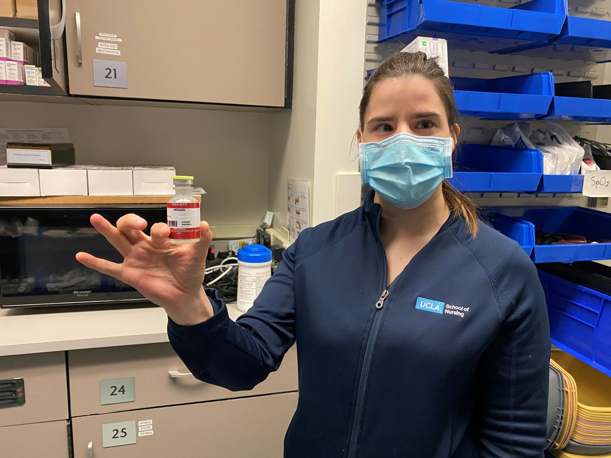 Sasha Karlin with prop medicine