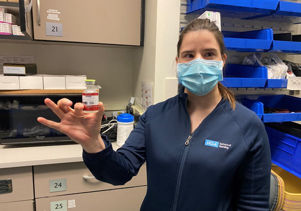 Sasha Karlin with prop medicine