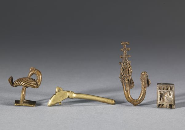Four weights used for measuring gold