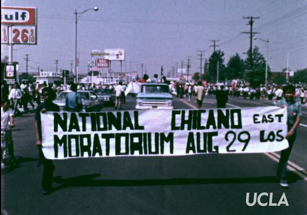 Marchers carry National Chicano Moratorium banner