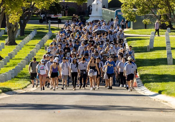 Students filing into veterans cemetery