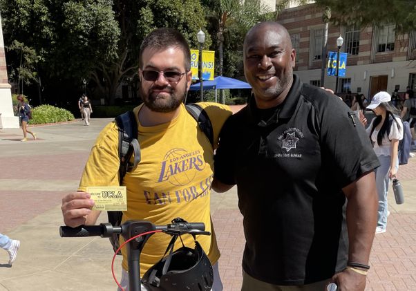 Click to open the large image: London McBride with UCLA student