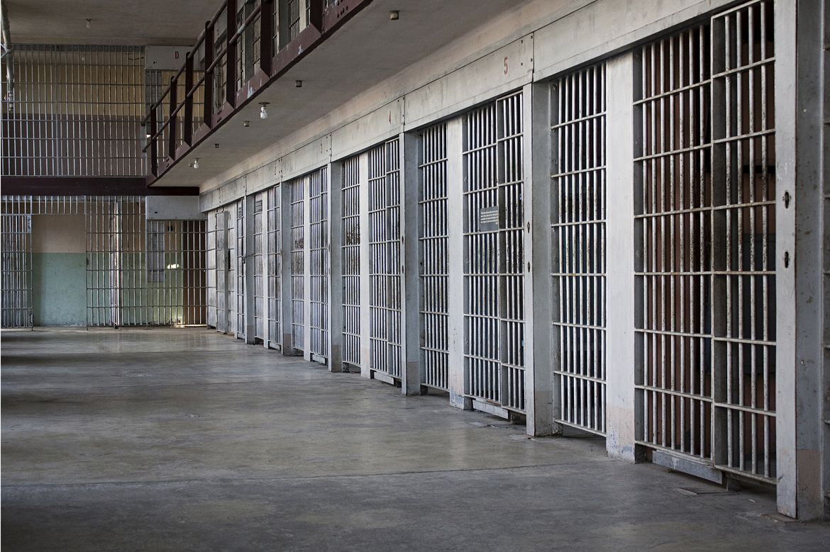 A row of empty prison cells