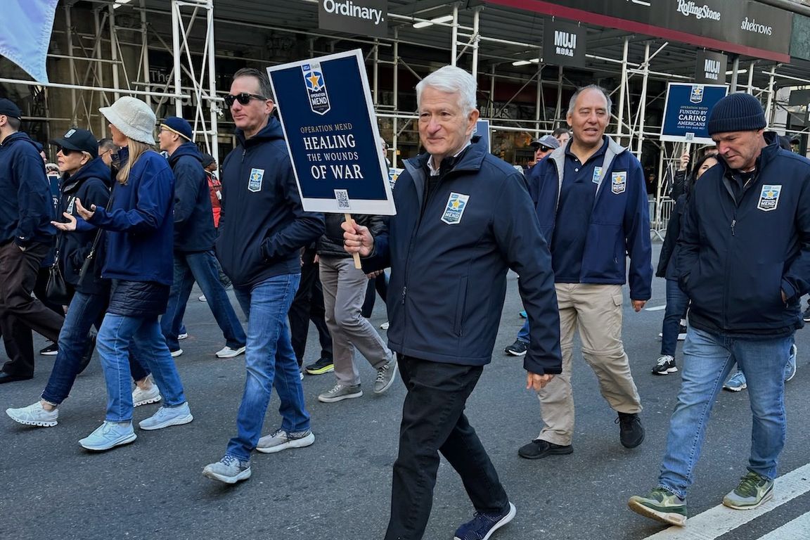 UCLA Chancellor Gene Block marching with UCLA Operation Mend in the New York City Veterans Day Parade