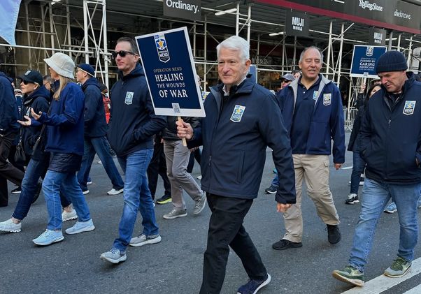 UCLA Chancellor Gene Block marching with UCLA Operation Mend in the New York City Veterans Day Parade