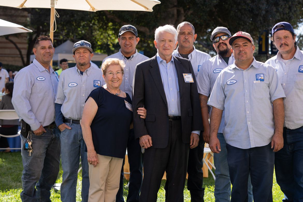 Carol Block and Chancellor Gene Block standing with a group of UCLA staffers