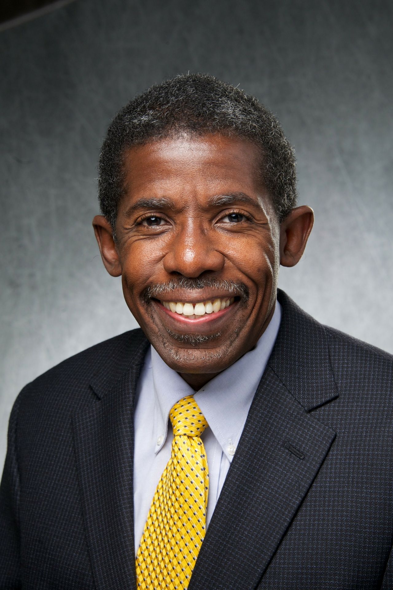 Headshot of E. Dale Abel in suit and yellow tie