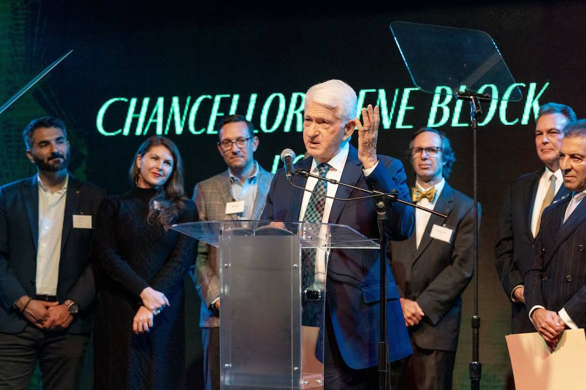 Chancellor Block speaking at podium after receiving award from LABC, with others in the background
