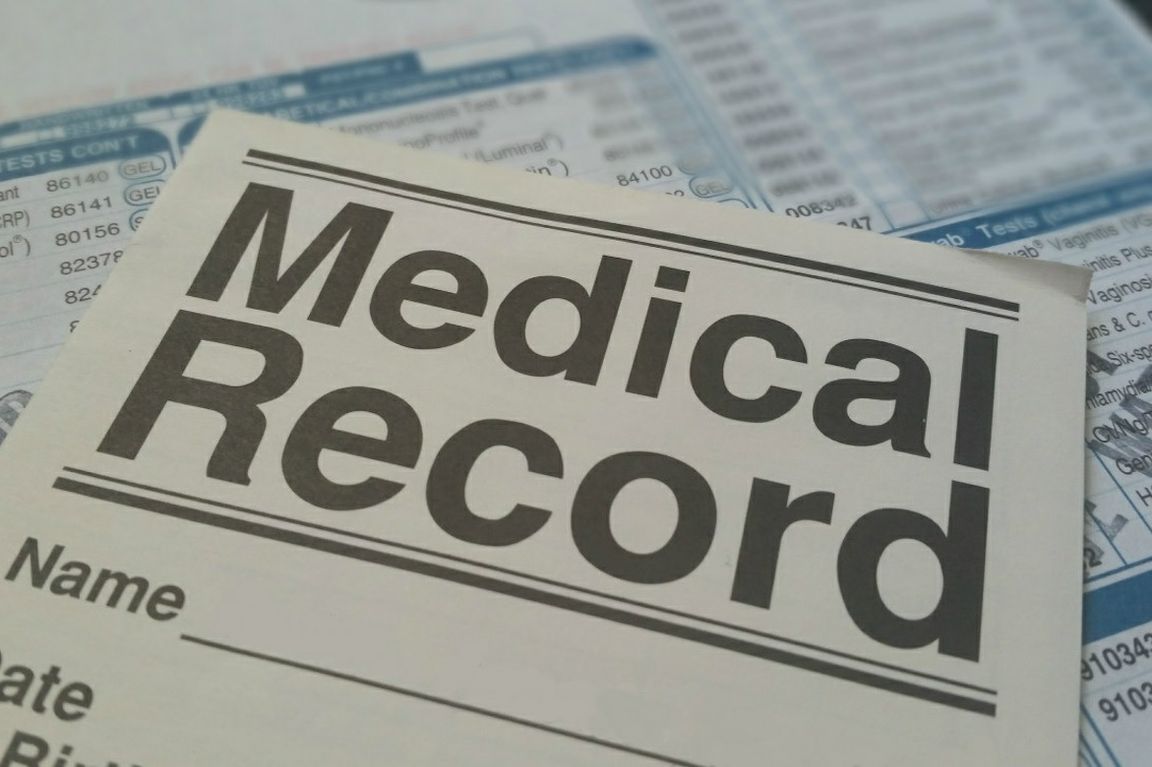 Piece of paper reading 'Medical Record'