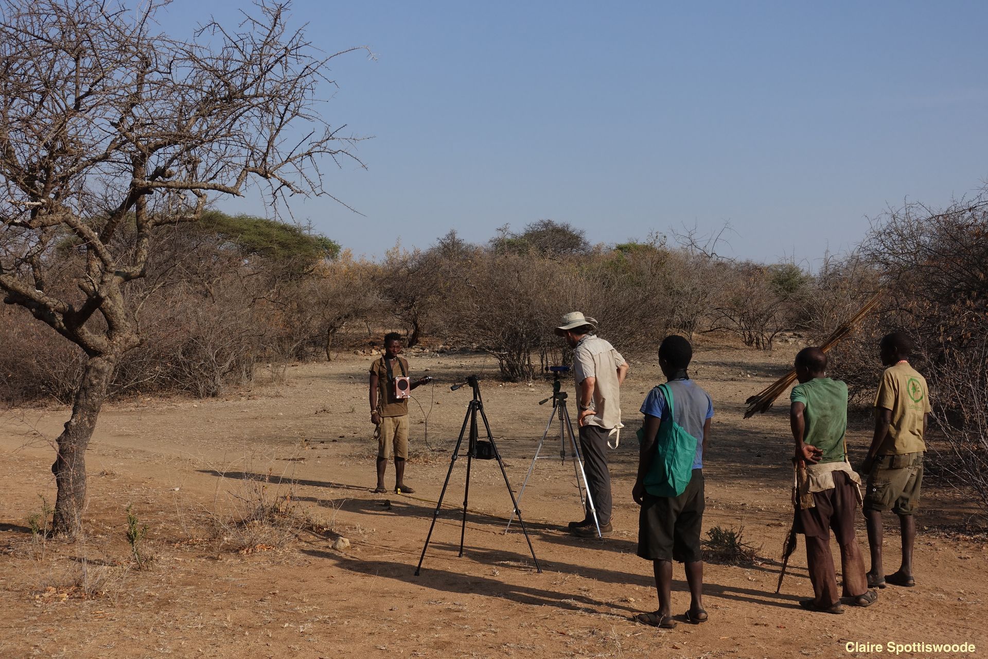 Brian Wood stands with four other people in field in Tanzania