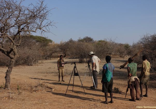 Brian Wood stands with four other people in field in Tanzania