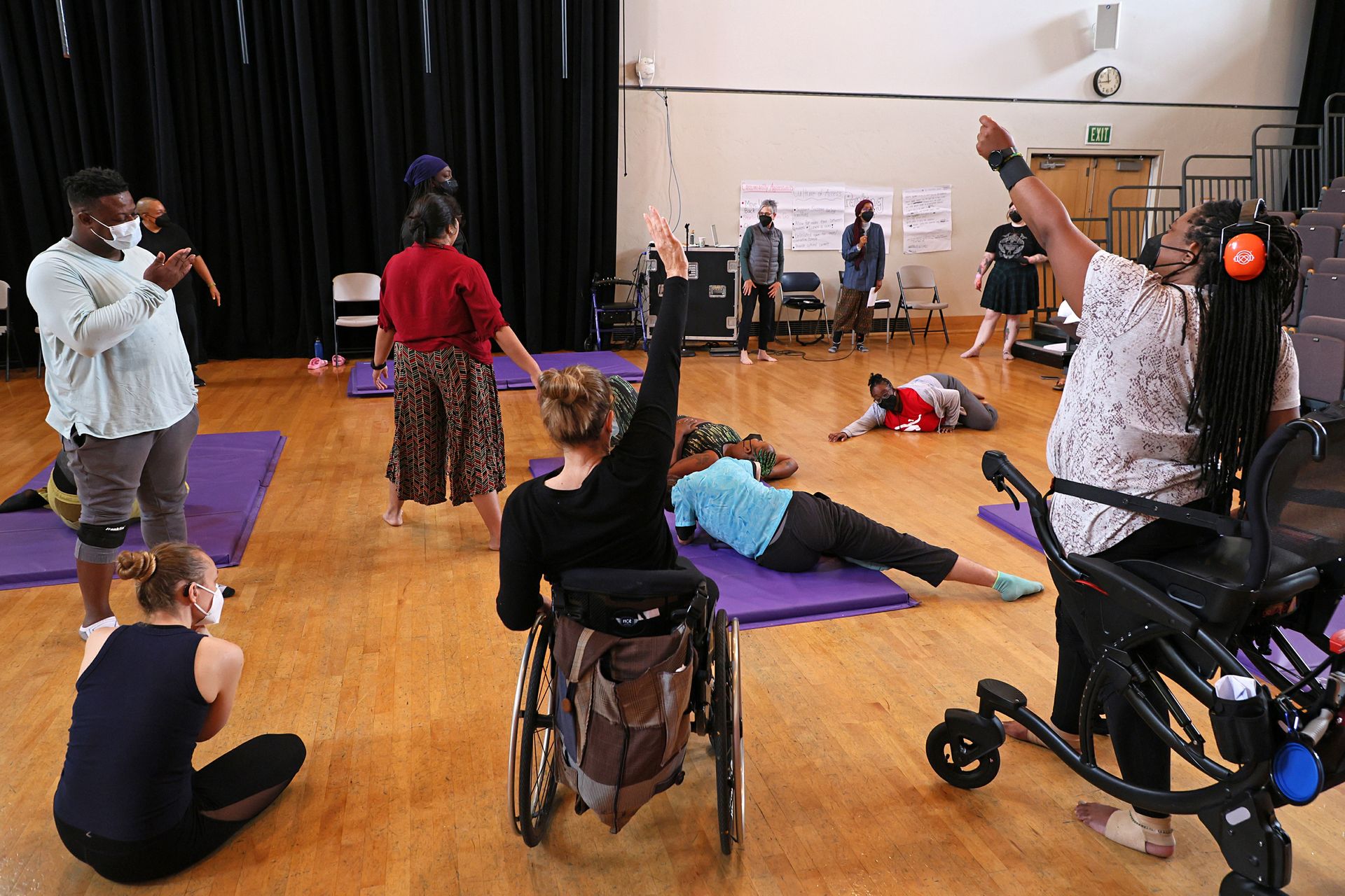Disabled dancers in motion photographed from behind