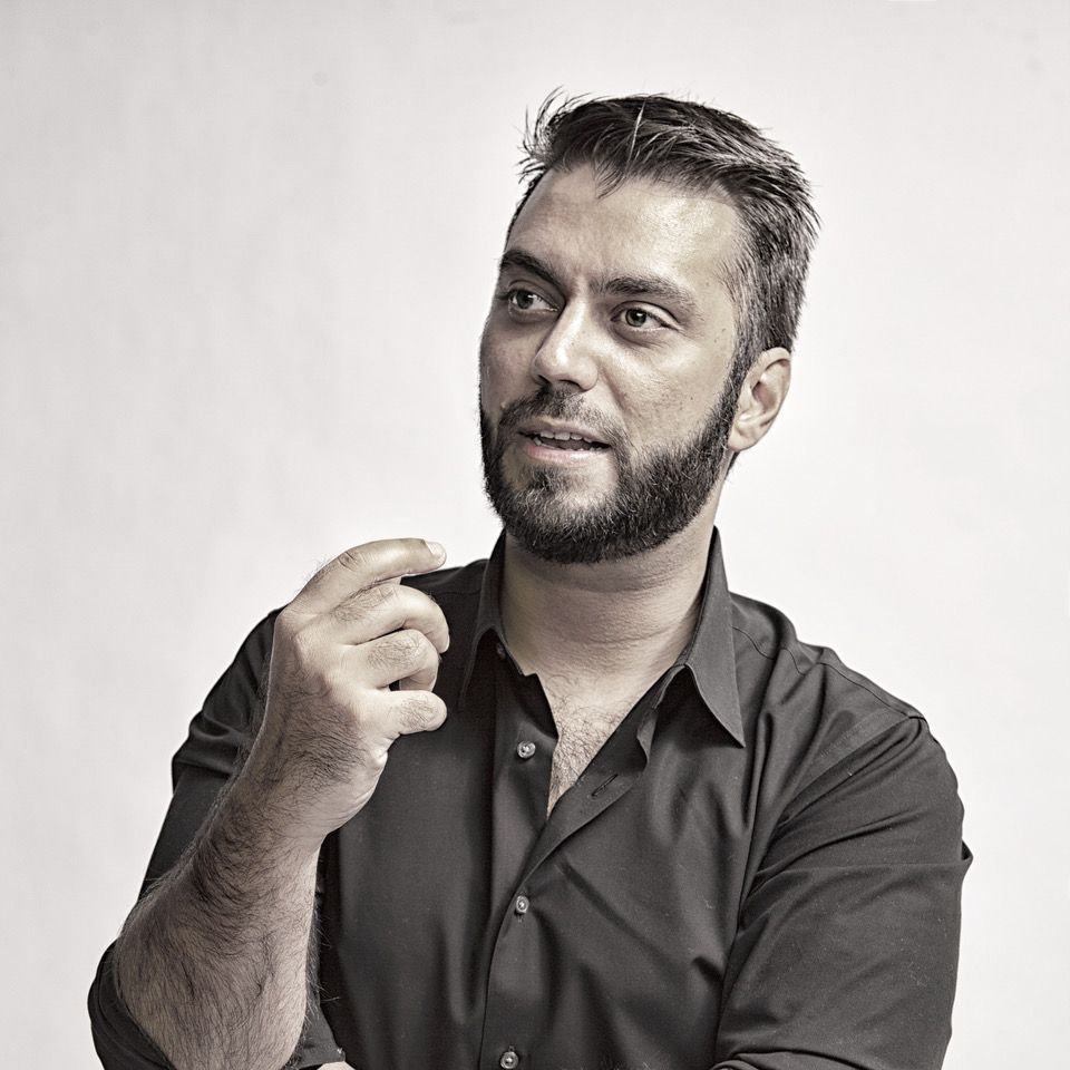 Güvenç Özel in black shirt