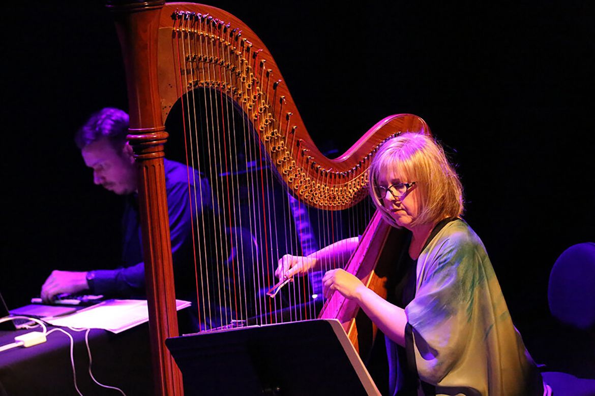 Anne LeBaron playing the harp