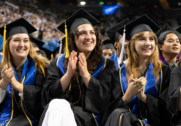 Graduates applauding at UCLA College commencement 