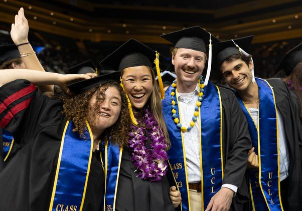 UCLA graduates celebrating in Pauley Pavilion 