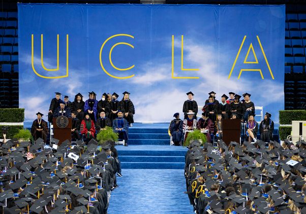 View of graduates and commencement stage in Pauley Pavilion 