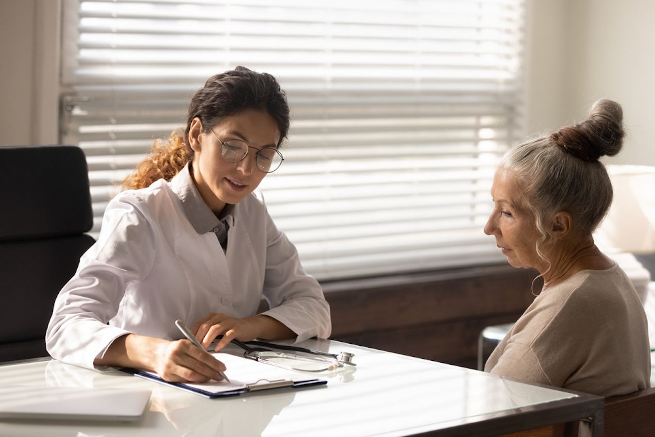 Health professional speaking to patient
