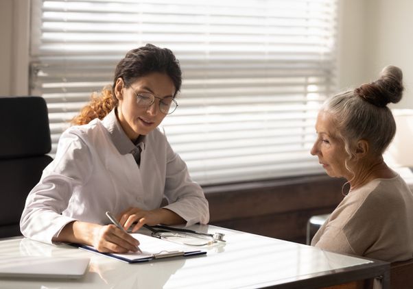 Health professional speaking to patient