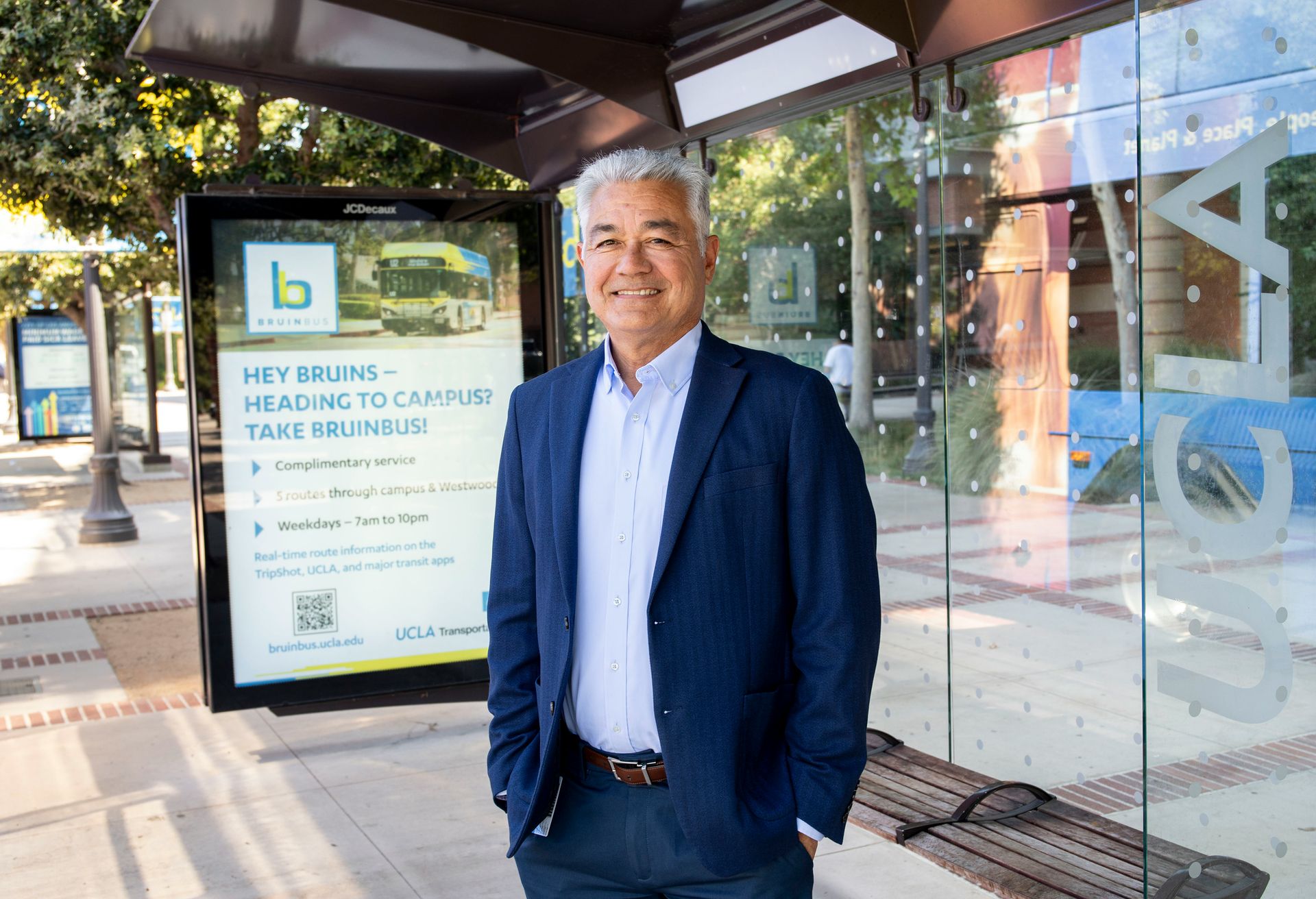 Tony Lucas standing at a bus stop