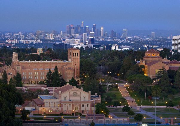 Overhead view of UCLA campus with downtown Los Angeles skyline in the background