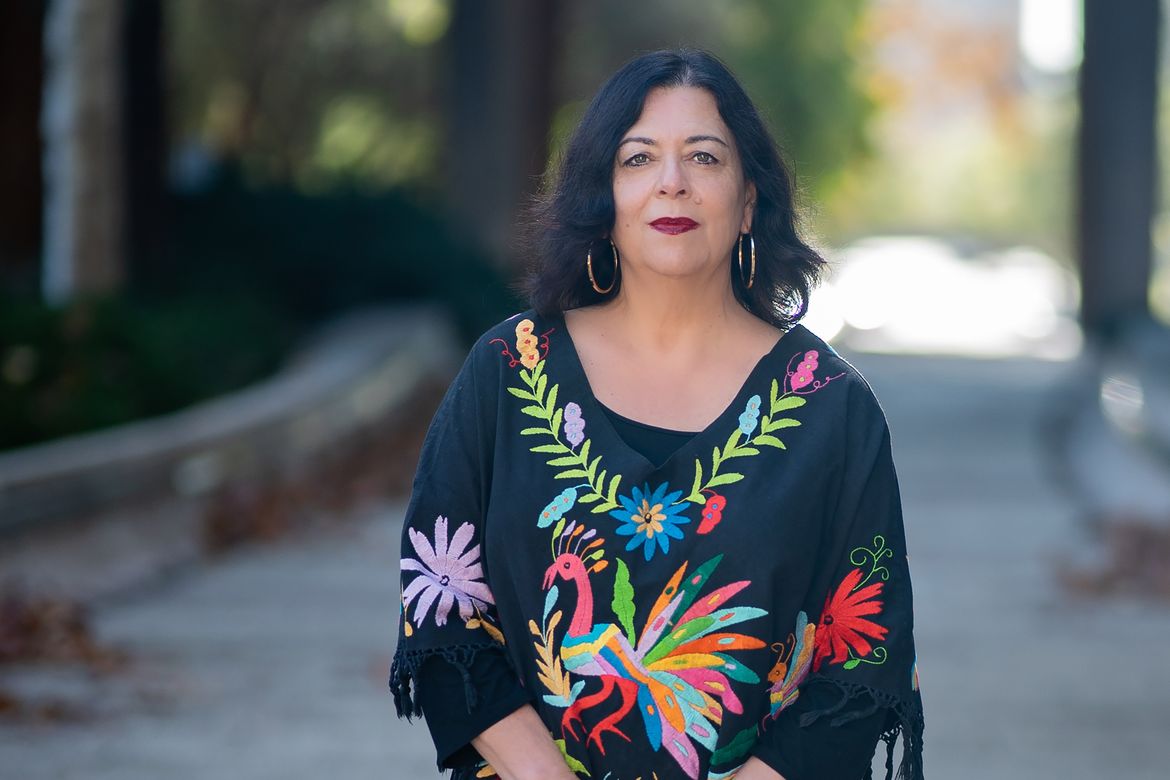 Charlene Villaseñor Black standing outside in colorful dress