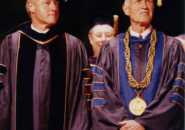 Bill Clinton and UCLA Chancellor Charles E. Young stand in academic regalia in 1994