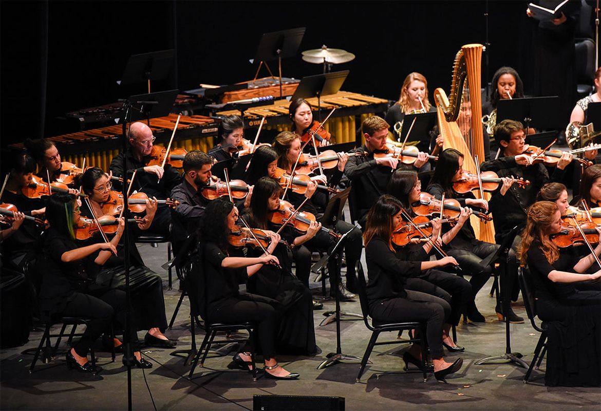 UCLA Philharmonia members playing violins and other instruments