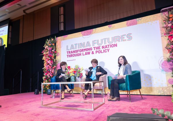 Mary Murguía, Janet Murguía and Margaret Salazar-Porzio on stage